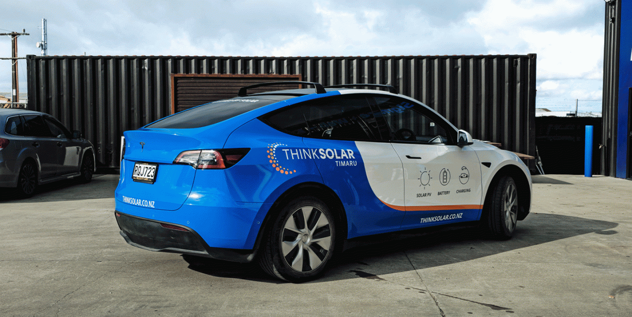 Close-up of premium vehicle wrap finish and graphics for Think Solar Timaru