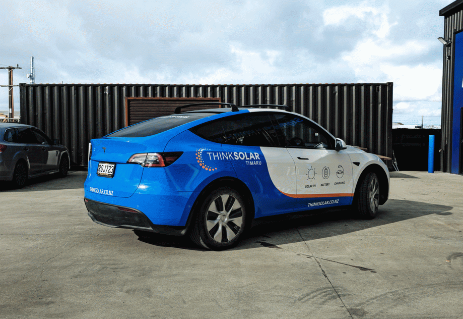 Close-up of premium vehicle wrap finish and graphics for Think Solar Timaru